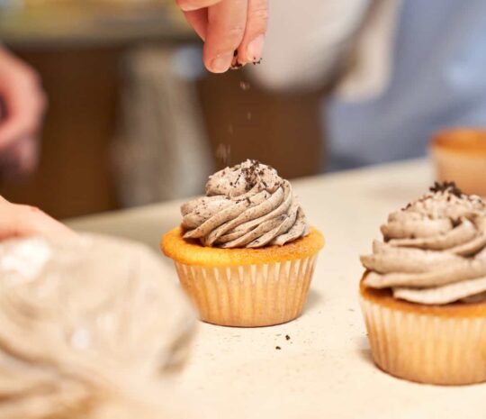crop-woman-decorating-cupcakes-with-chocolate-2022-05-26-22-21-37-utc (2)